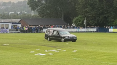 Five charged over football pitch hearse disorder