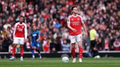 Arsenal fans must be better to help team in title hunt - Rooney