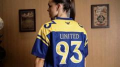 Oxford apologise for United 93 shirt advert